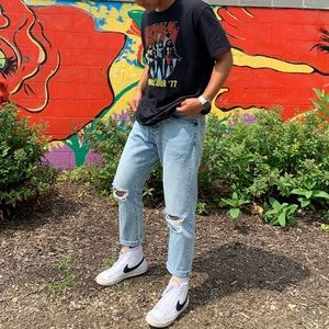 Relaxed fit men’s jeans. light wash, ripped